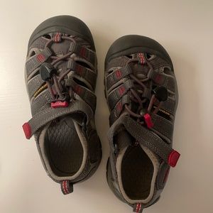 Grey Keen shoes with red accents